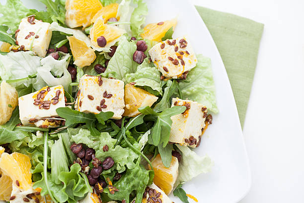 Raw salad with tofu, orange and azuki beans